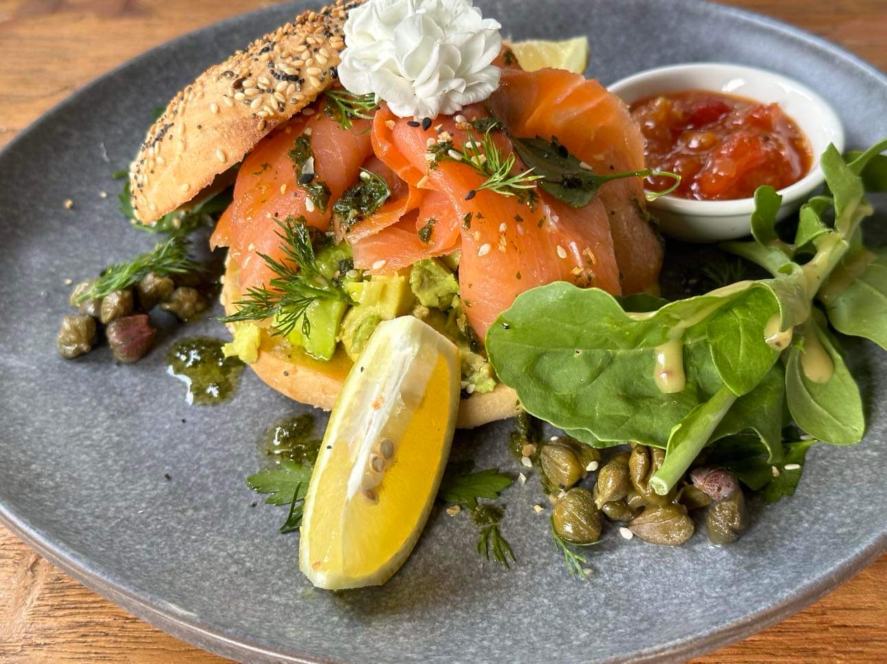 Smoked Salmon Stack on a toasted bagel with capers and lemon